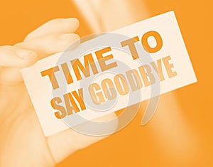 Time to Say Goodbye words on a card in hand of businessman. Business agreement termination concept