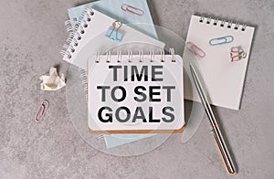 Time to Set Goals Text Written on a Notebook on the Wooden Background.