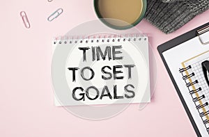 TIME TO SET GOALS written in a white notebook