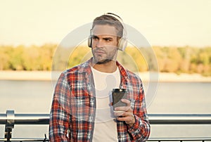 Time to take break. man in headset listen song. music style. elearning while drinking coffee. quality of sound. good