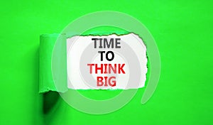 Time to think big symbol. Concept words Time to think big on beautiful white paper. Beautiful green background. Business and time