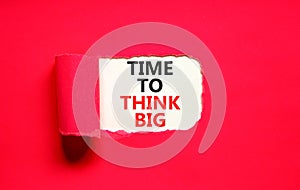 Time to think big symbol. Concept words Time to think big on beautiful white paper. Beautiful red background. Business and time to