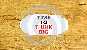 Time to think big symbol. Concept words Time to think big on beautiful white paper. Beautiful wooden background. Business and time