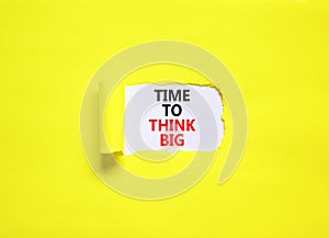 Time to think big symbol. Concept words Time to think big on beautiful white paper. Beautiful yellow background. Business and time