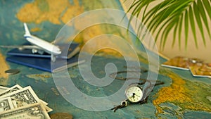 Time to travel concept. Tropical vacation theme with world map, blue passport and plane. Preparing for holliday, journey