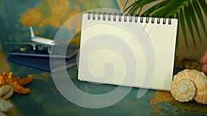 Time to travel concept. Tropical vacation theme with world map, blue passport and plane. Preparing for holliday, journey