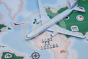 Time to Travel. Idea for tourism with airplane, compass and map on a light background. Concept on the theme of flights.