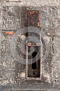 Time-worn door with a big keyhole