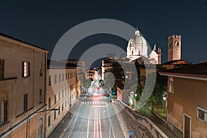 Timed zoom. Night view, of the dome of the Duomo Nuovo with movement of the city