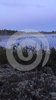 Timelaps moonrise over the lake. Fog over the water