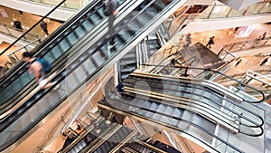 Timelapse of Asian people customer transport on escalator at urban shopping mall in Hong Kong. Asia city life