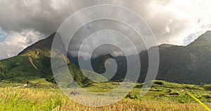 Timelapse Beautiful landscape mountain green field grass meadow white cloud blue sky sunny day. Time lapse Majestic green scenery