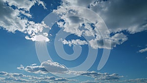 Building clouds and sun rays breaking through cloud mass. Flares shinning through dramatic clouds. Timelapse.