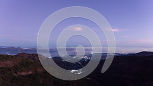 Timelapse - Citylights during sunrise from a mountain 4K60