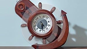 Timelapse of the clock in the shape of an anchor and a ship's helm