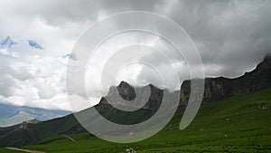 Timelapse of clouds and the Caucasus Mountains at the Aktoprak pass in Russia