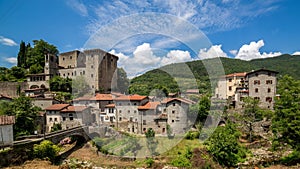 Timelapse clouds on medieval village and castle in tuscany. Italy