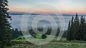 Timelapse, clouds over a green field in summer