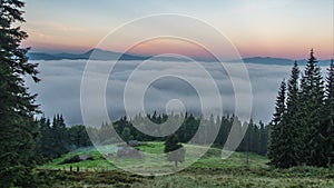 Timelapse, clouds over a green field in summer