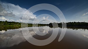 Timelapse of clouds reflected on pond in Everglades National Park 4K.