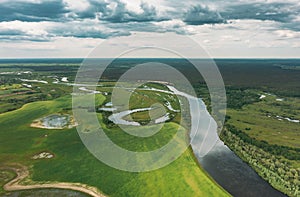 Timelapse Dronelapse Hyperlapse Aerial View Spring Meadow Field Pasture And River. Springtime Landscape. Top View