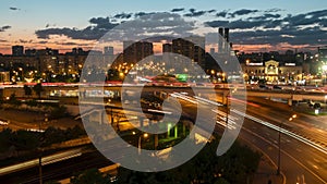 Timelapse: fast moving cars traffic with trails and warm street light at night