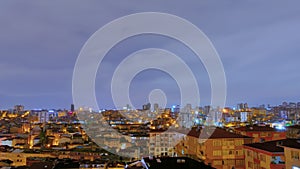 Timelapse: fast moving clouds over living apartment building in Turkey at night