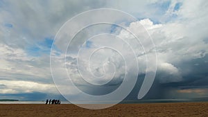 Timelapse footage of Storm clouds and rain over sea.