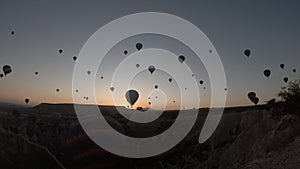 Timelapse of the hot air balloons flying around during sunset, Cappadocia, 4k