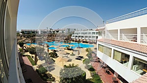 Timelapse of Hotel Resort with Blue Swimming Pool, Umbrellas and Sunbeds in Egypt