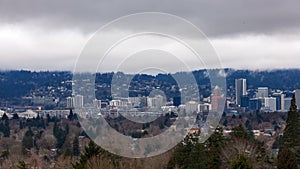 Timelapse of low white clouds over city skyline and auto traffic downtown Portland Oregon one winter day 4k uhd