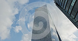 Timelapse of modern glass skyscraper in Tel Aviv, Israel with cloud relfections