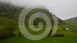 Timelapse in mountains in a foggy summer morning