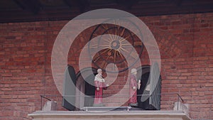 Timelapse. A Musical clock represents two figures standing on the veranda of the Collegium Maius, KrakÃ³w.