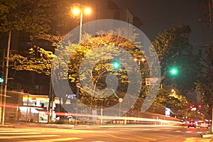 Timelapse in nigth, Beautiful Cityscape with a cars, motorbikes and traffic on the road.