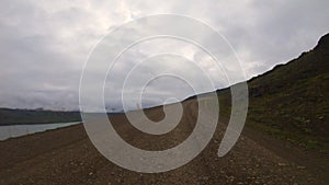 Timelapse POV Iceland Westfjords Driving Plate. Facing Camera Paved Roads and Dirt Roads Along Mountains and Fjords