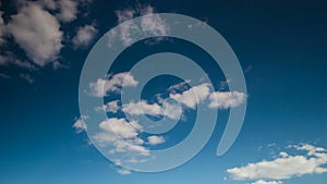 Timelapse rolling clouds, Clouds running across brilliant blue sky, Cumulus cloud form against a dark blue sky