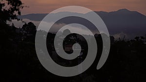 Timelapse: Rolling mists roll over the hillside homes of Sausalito at Sunset