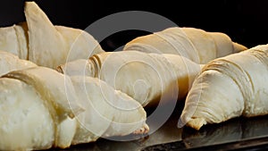 Timelapse - six croissants baking and rising in electric oven at home: close up