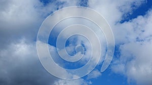 Timelapse of the sky with white running clouds passing from dark to stormy