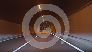 Timelapse of a speedy night drive trip through the Madeira tunnels. View from the car windshield to the road. Hyperlapse