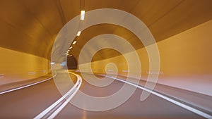 Timelapse of a speedy night drive trip through the Madeira tunnels. View from the car windshield to the road. Hyperlapse