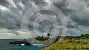 Timelapse Storm clouds over the Nusa Ceningan island in cloudy weather, Bali, Indonesia