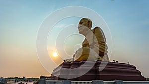 Timelapse sunrise at the big Buddhist Monks Luang Phor Tuad