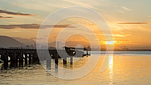 Timelapse sunrise disrepair fishing dock