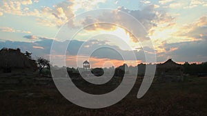 Timelapse of sunrise over countryside, clouds running across sky