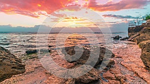 Timelapse Sunset on the stony beach of the island Nusa Ceningan, Indonesia