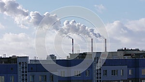 Timelapse of thick white smoke coming out of chimneys of thermal power plant