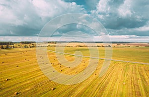 Timelapse Time lapse Dronelapse Hyperlapse. Aerial View Of Haystacks In Summer Agricultural Field. Transport In Motion