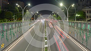 Timelapse of underpass car traffic at night, with cars driving through an inner city tunnel called Pasajul Unirii.